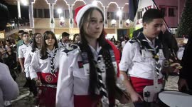 Palestinians gather to celebrate the lighting of the Christmas tree in Gaza city