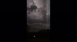 Intense lightning across Arkansas night sky amid tornado warning
