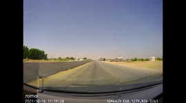 Quick reflexes help save from a car crash on a one way busy highway