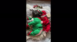 Cute alert! Dog and baby cuddling in full Christmas attire