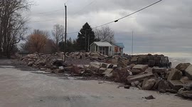 Waves Crash On Cottage During Fierce Wind Storm