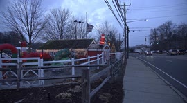 View from public sidewalk near Stew Leonard's store with evening street lights and holiday decoration