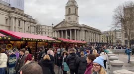 Busy Christmas market at Trafalgar Square, London, UK 12 December 2021