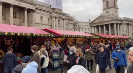 Shoppers in London enjoy Trafalgar Square Christmas market
