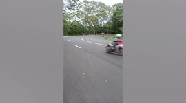 Motorist nearly loses balance while drifting on road in the Philippines