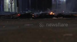 Palestinians gather at the site where man was killed and injured two others during a night military raid in the area of Ras al-Ain in the West Bank city of Nablus