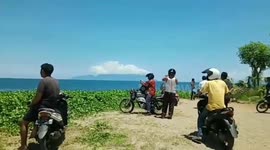 Locals anxiously look out to sea for tsunami after Indonesian quake