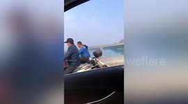 Chinese man drags woman at the back of scooter after having argument