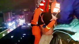 Firefighters rescue drunk man who fell asleep on 15th-floor air-conditioner unit in China