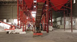 Palestinians work in a feed factory in Gaza city