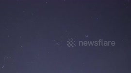 Geminid meteors streak across night skies above Swiss Alps