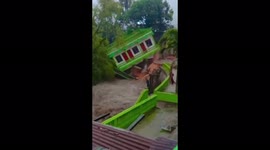 Dramatic moment that house collapses into river in Indonesia
