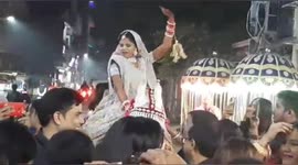 Bride breaks Indian tradition by leading wedding procession riding a horse