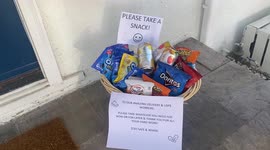 Spreading holiday cheer with a snack basket for delivery workers