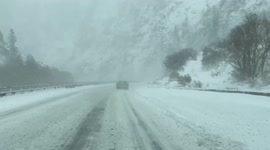 Strong winds and heavy snow create dangerous driving conditions on I-70 in Colorado.