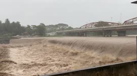 Super typhoon Rai causes swollen river as storm hits the Philippines