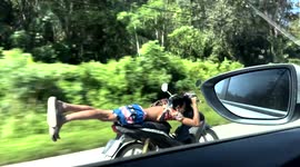 Rider ‘planks’ on motorcycle while speeding along road