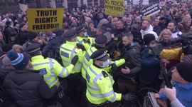 Missiles thrown at police during ugly scenes at 'anti-covid restriction' protest outside Parliament in London