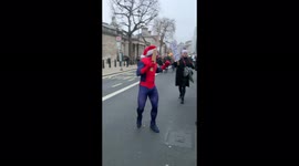 Spider man in a Santa hat attends an anti lockdown protest in London.
