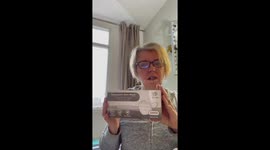 Woman makes spoof try on haul but with face masks and COVID-19 test kits