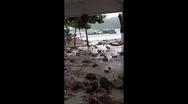 Typhoon Rai sweeps through Vietnam, thrashing houses near the sea
