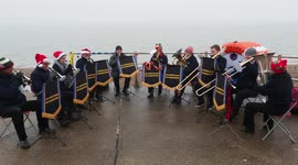 Band performs Christmas songs in the fog in Kent, UK