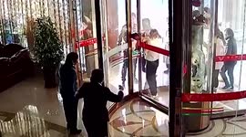 Passersby join effort to rescue baby who got head stuck in hotel's revolving doors in China