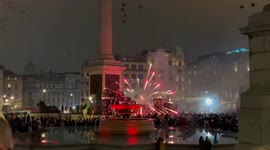 Fireworks explode in close proximity to Algerian football fans celebrating Arab Cup win