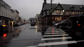 Busy Post road in downtown area in rainy afternoon on week before Christmas