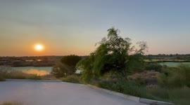 Sunset in the Hermosillo Metropolitan Park, wetland and recreational park with recycled sewage in the west of Hermosillo. Green water, Aqua color, artificial lake .