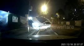 Car in China bounces off a manhole cover and into an electricity pole