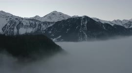 Drone crash on a tree while flying in the clouds in a mountainous area