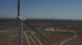 Aerial view of a wind power generator in a desert valley in Puerto Peñasco, Mexico. Sonoran Desert blades of a wind turbine in electric energy, electric generator moved by a turbine driven by the wind, blades, horizon, Gulf of California, Gulf of Santa Cl