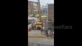Man crushed to death in London after construction crane drops load