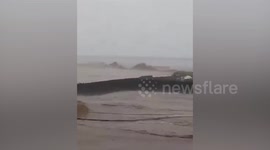 Residents work together to save house swept away by super typhoon Rai in the Philippines