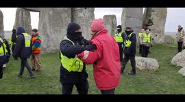 'Just keep moving!' Security pushes man refusing to leave Stonehenge after winter solstice