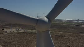 Aerial view of a wind power generator in a desert valley in Puerto Peñasco, Mexico. Sonoran Desert blades of a wind turbine in electric energy, electric generator moved by a turbine driven by the wind, blades, horizon, Gulf of California, Gulf of Santa Cl