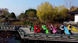 Chinese photographer too focused on taking pictures falls into pond in hilarious fashion
