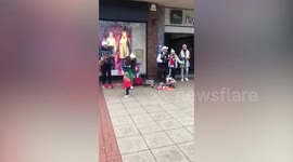 UK toddler goes viral after stealing the show in Christmas street concert