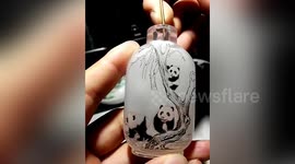 Watch this Chinese handicraftsman perfectly paint artwork inside tiny bottles