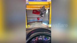 Garage shutter catches e-motorcycle and drags up into air in northern China