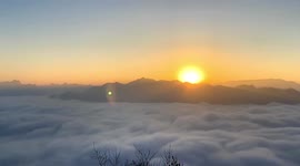 Drone footage reveals mountaintops poking through layer of clouds in northern China
