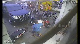 Shocking moment the arrogant car driver crashes into the parking motorbike but he is gets angry and beats the motorbike owner