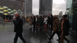 Carol Singers Outside Stratford Station Bring Cheer To People At Christmas Eve