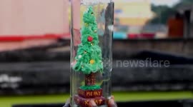 Artist creates miniature Christmas tree inside bottle in eastern India