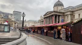 Quiet Christmas market at Trafalgar Square on Christmas Eve, London, UK