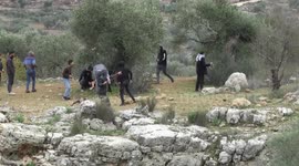 Palestinian protesters clash with Israeli security forces following a demonstration against settlements in the village of Beita in the West Bank