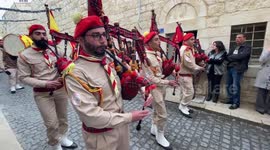 Palestinian scouts parade outside the Church of the Nativity during Christmas celebrations