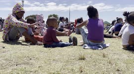In-need Cape Town kids line up for Christmas meal in South Africa