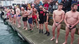 Christmas Day harbour swim at Weymouth, UK attracts hundreds